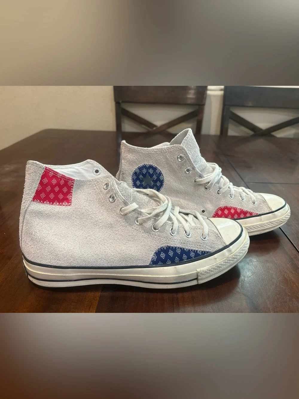 Converse Chuck Taylor’s White High Top Sneakers with Red and Blue Accents